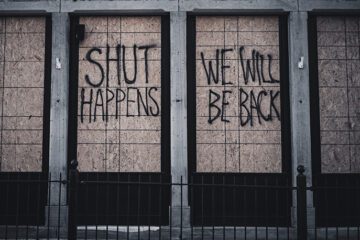 boarded up shop window due to lockdown