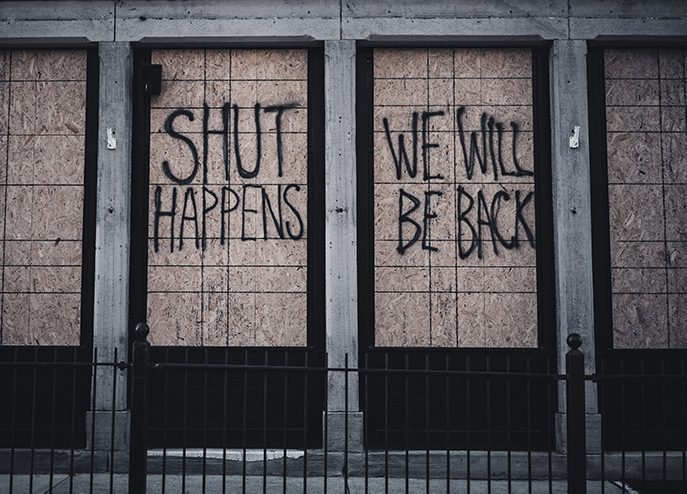 boarded up shop window due to lockdown